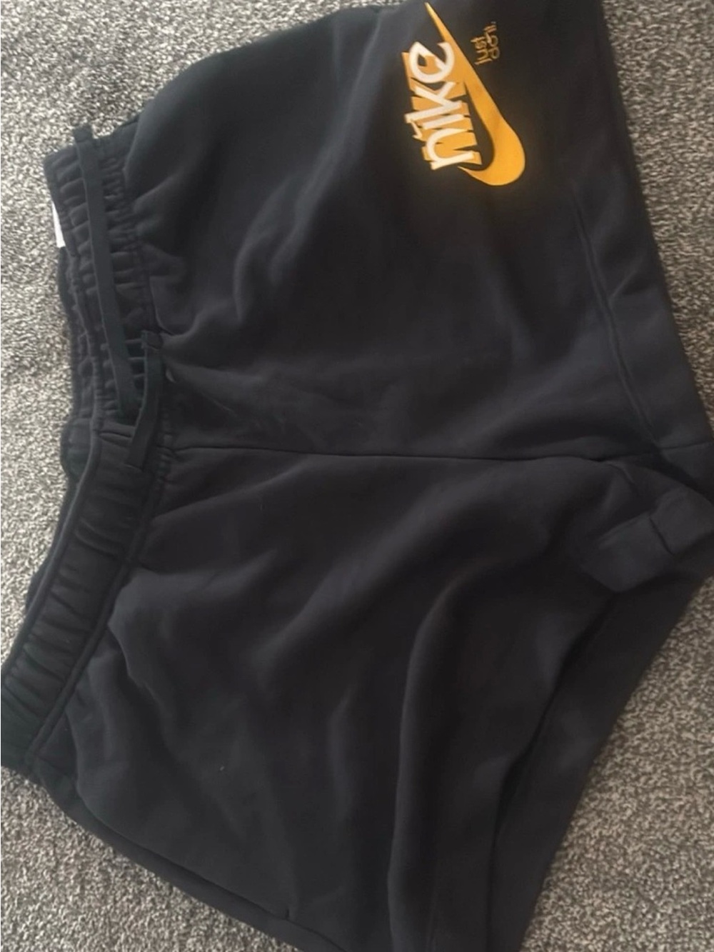 Nike Women’s Black Athletic Shorts with Gold Logo
